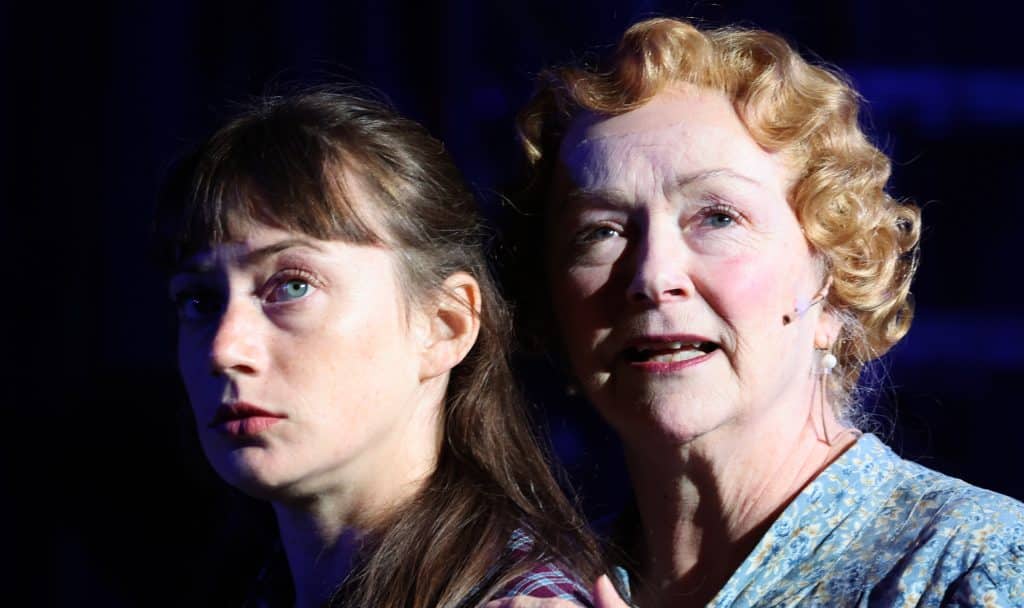 Two actresses staring into the distance